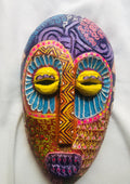 Ije Mmuo – Viaje espiritual, a hand-carved MASK-WE Gmelina wood mask painted by Ngozi Uchenna Eze