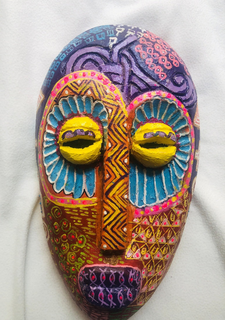 Ije Mmuo – Viaje espiritual, a hand-carved MASK-WE Gmelina wood mask painted by Ngozi Uchenna Eze