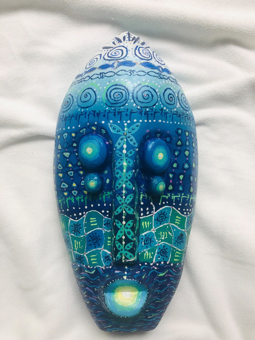 Enyí-Dios, a hand-carved MASK-WE Gmelina wood mask painted by Sophia Ahuoyiza Abubakar