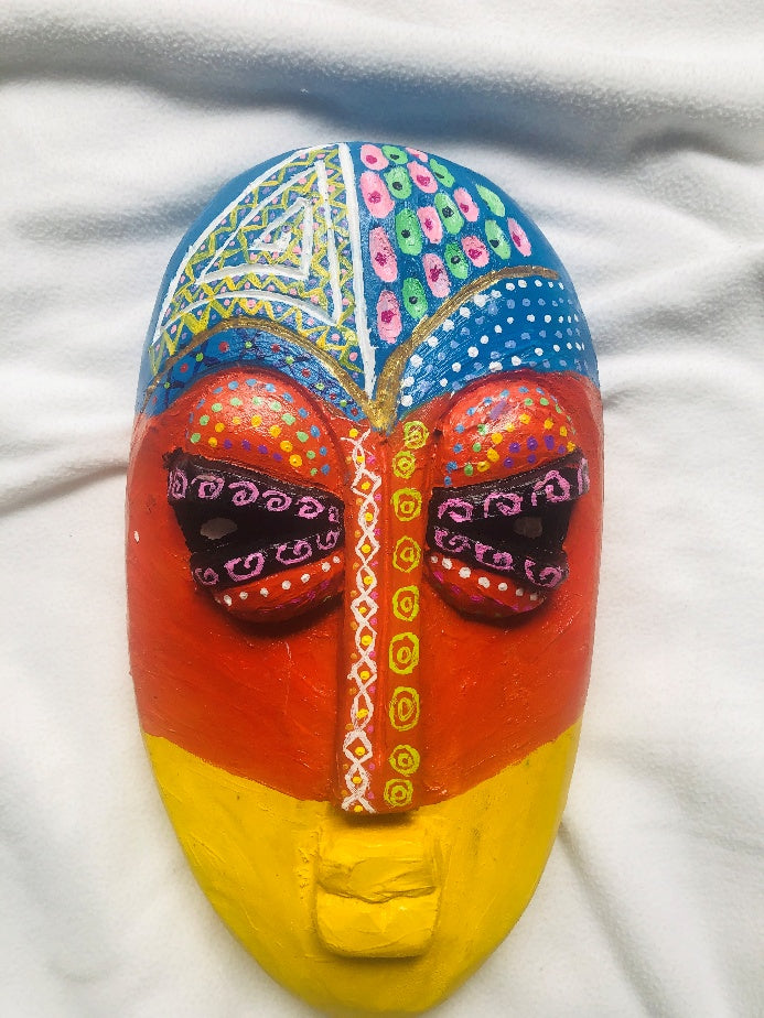Incomplete mask, a hand-carved MASK-WE Gmelina wood mask painted by Favour Ijeoma Egbo