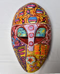 Ifunanya - Amor, a hand-carved MASK-WE Gmelina wood mask painted by Benedeth Maduka