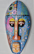 Ujomo - Unidad, a hand-carved MASK-WE Gmelina wood mask painted by Oluchi Adaeze Silver
